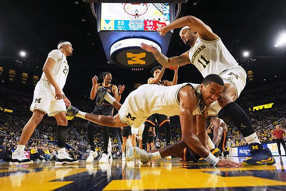 Yaxel Lendeborg (23), Nimari Burnett (4), and Roddy Gayle Jr. (11)