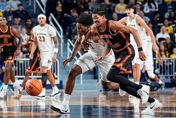 Yaxel Lendeborg (23), Morez Johnson Jr. (21), and Aday Mara (15)