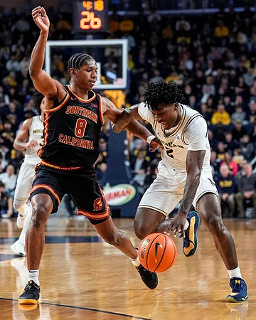 L.J. Cason (2) and Elliot Cadeau (3)