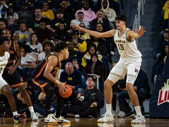 L.J. Cason (2) and Aday Mara (15)