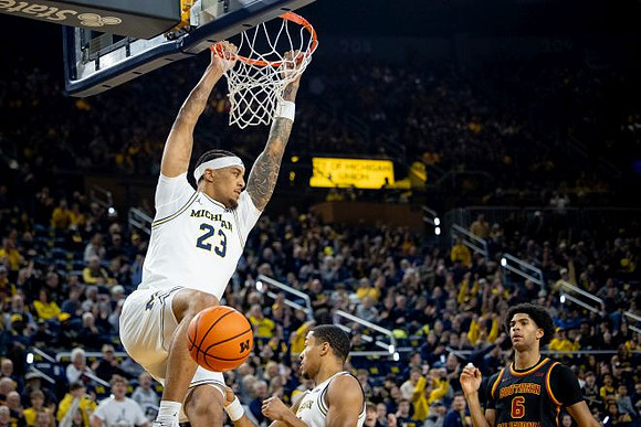 Yaxel Lendeborg (23) and Nimari Burnett (4)