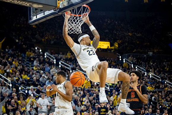 Yaxel Lendeborg (23) and Nimari Burnett (4)