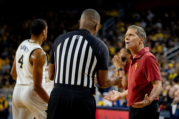Elliot Cadeau (3) and USC Head Coach Eric Musselman
