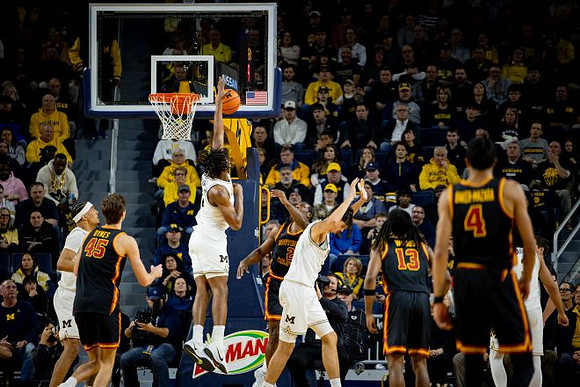Yaxel Lendeborg (23), L.J. Cason (2), Aday Mara (15), and Elliot Cadeau (3)