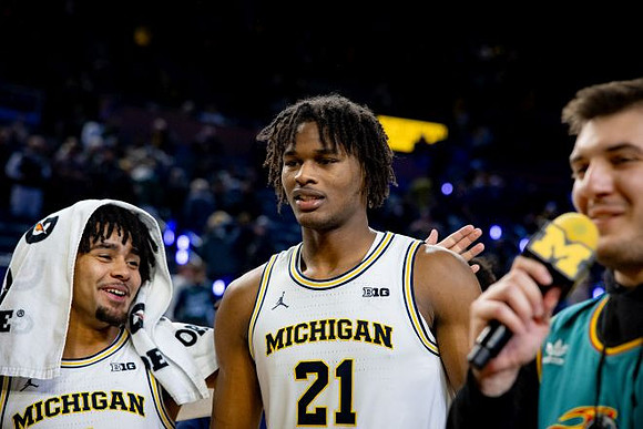 Elliot Cadeau (3) and Morez Johnson Jr. (21)