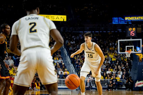 L.J. Cason (2) and Aday Mara (15)