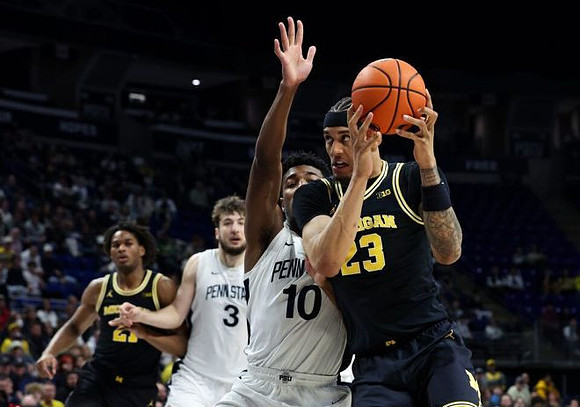 Morez Johnson Jr. (21) and Yaxel Lendeborg (23)