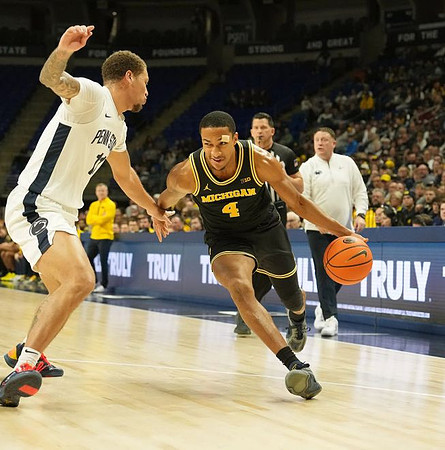 Nimari Burnett (4) and Penn State Head Coach Mike Rhoades
