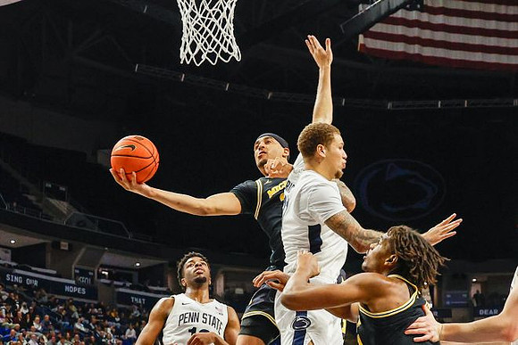 Yaxel Lendeborg (23) and Morez Johnson Jr. (21)