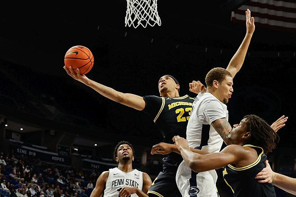 Yaxel Lendeborg (23) and Morez Johnson Jr. (21)