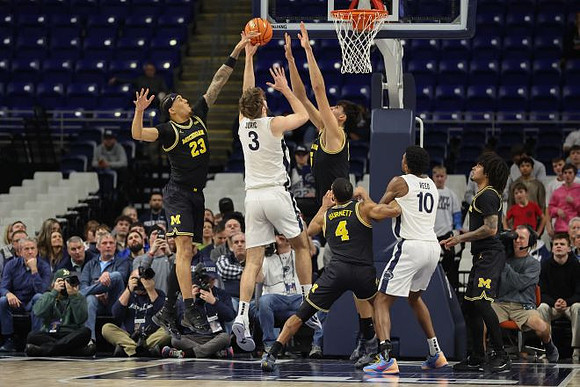 Yaxel Lendeborg (23), Aday Mara (15), Nimari Burnett (4), and Elliot Cadeau (3)