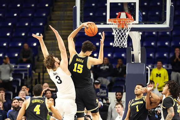 Nimari Burnett (4), Aday Mara (15), Trey McKenney (1), and Elliot Cadeau (3)