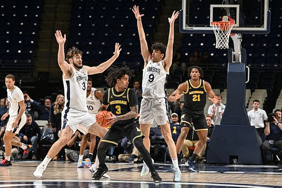 Elliot Cadeau (3) and Morez Johnson Jr. (21)