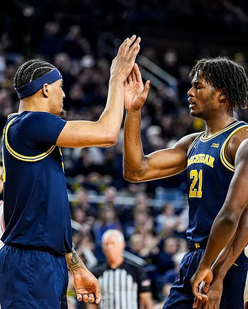 Yaxel Lendeborg (23) and Morez Johnson Jr. (21)
