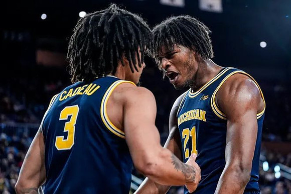 Elliot Cadeau (3) and Morez Johnson Jr. (21)