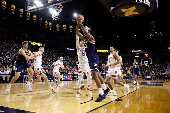 Will Tschetter (42), Morez Johnson Jr. (21), and Yaxel Lendeborg (23)