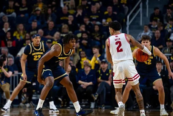 Yaxel Lendeborg (23), Morez Johnson Jr. (21), and Will Tschetter (42)