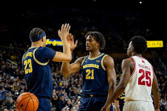 Yaxel Lendeborg (23) and Morez Johnson Jr. (21)