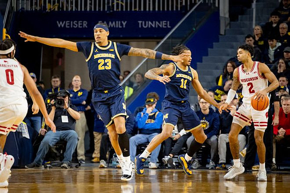 Yaxel Lendeborg (23) and Roddy Gayle Jr. (11)