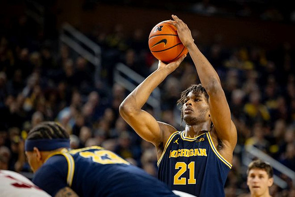 Yaxel Lendeborg (23) and Morez Johnson Jr. (21)