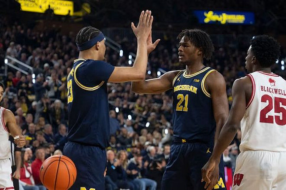 Yaxel Lendeborg (23) and Morez Johnson Jr. (21)