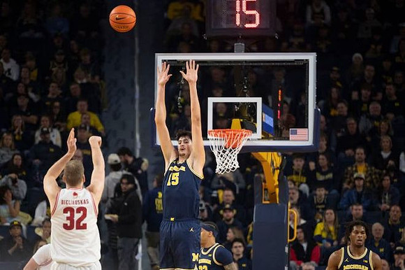 Yaxel Lendeborg (23), Aday Mara (15), and Morez Johnson Jr. (21)