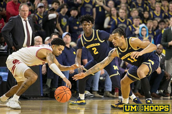 Wisconsin Head Coach Greg Gard, L.J. Cason (2), and Roddy Gayle Jr. (11)