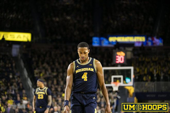 Yaxel Lendeborg (23) and Nimari Burnett (4)