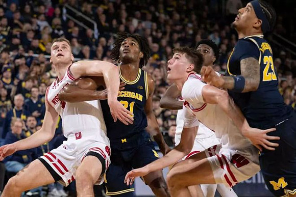 Morez Johnson Jr. (21) and Yaxel Lendeborg (23)