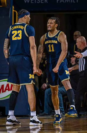 Yaxel Lendeborg (23) and Roddy Gayle Jr. (11)