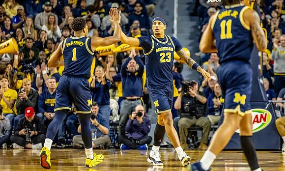 Trey McKenney (1), Yaxel Lendeborg (23), and Roddy Gayle Jr. (11)