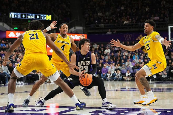 Morez Johnson Jr. (21), Nimari Burnett (4), and Yaxel Lendeborg (23)