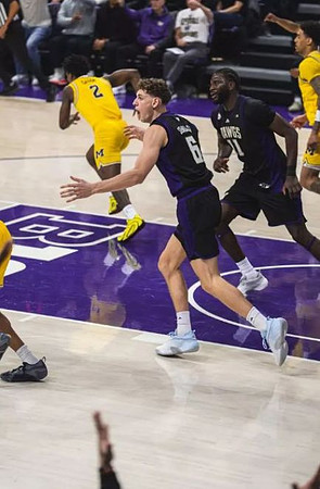 L.J. Cason (2) and Yaxel Lendeborg (23)