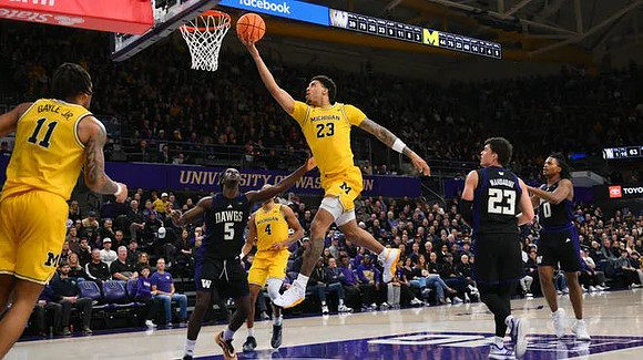 Roddy Gayle Jr. (11), Yaxel Lendeborg (23), and Nimari Burnett (4)