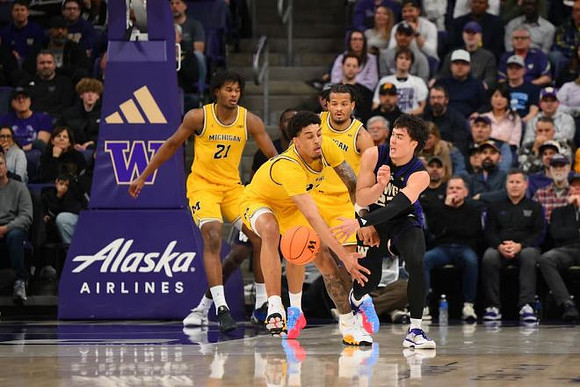 Morez Johnson Jr. (21), Yaxel Lendeborg (23), and Roddy Gayle Jr. (11)