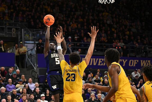 Yaxel Lendeborg (23), Morez Johnson Jr. (21), and Elliot Cadeau (3)