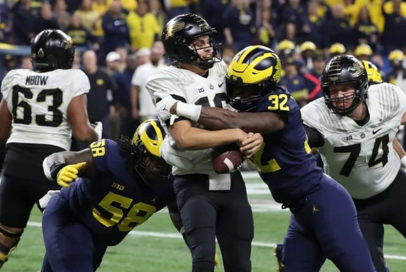 Mazi Smith (58) and Jaylen Harrell (32)