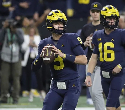 J.J. McCarthy (9) and Davis Warren (16)