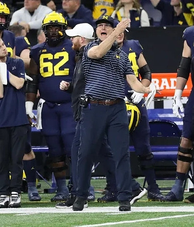 Raheem Anderson (62) and Jim Harbaugh