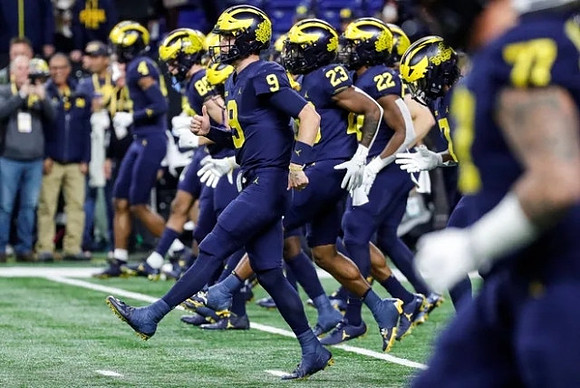 J.J. McCarthy (9) and Michigan Team