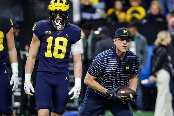 Colston Loveland (18) and Jim Harbaugh