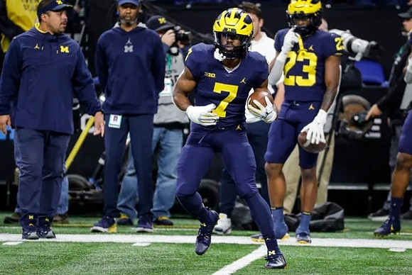 Mike Hart, CJ Stokes (23), and Donovan Edwards (7)