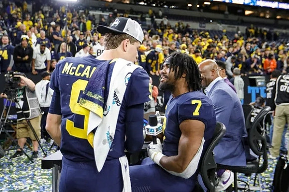 J.J. McCarthy (9) and Donovan Edwards (7)