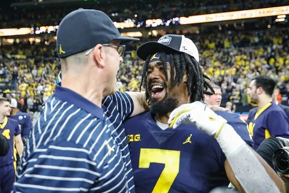Jim Harbaugh and Donovan Edwards (7)