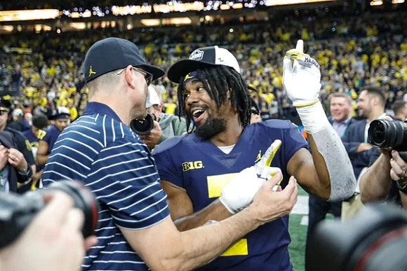 Jim Harbaugh and Donovan Edwards (7)
