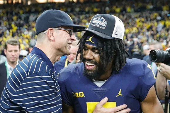 Jim Harbaugh and Donovan Edwards (7)