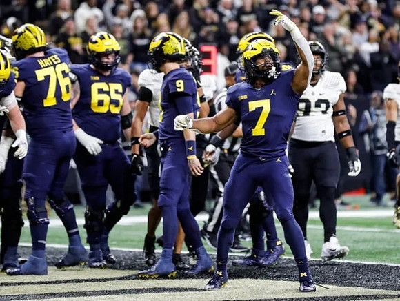 Ryan Hayes (76), Zak Zinter (65), J.J. McCarthy (9), and Donovan Edwards (7)