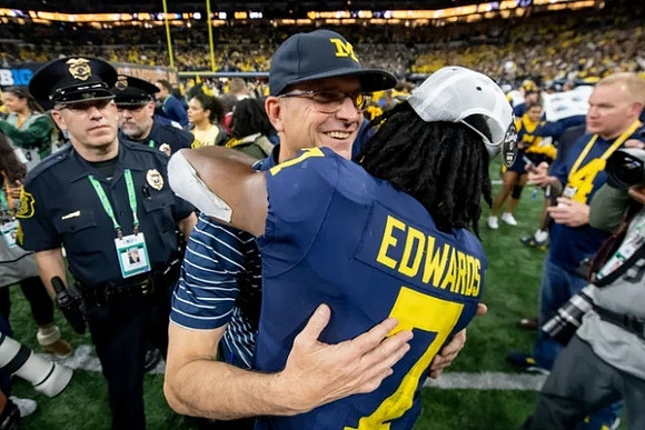 Jim Harbaugh and Donovan Edwards (7)