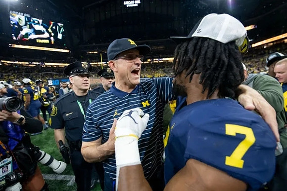 Jim Harbaugh and Donovan Edwards (7)