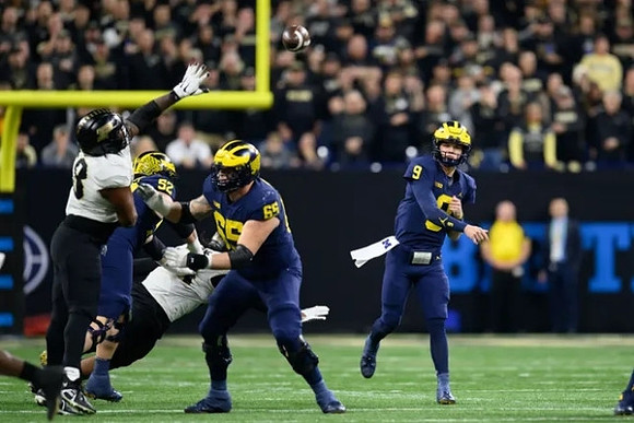 Karsen Barnhart (52), Zak Zinter (65), and J.J. McCarthy (9)